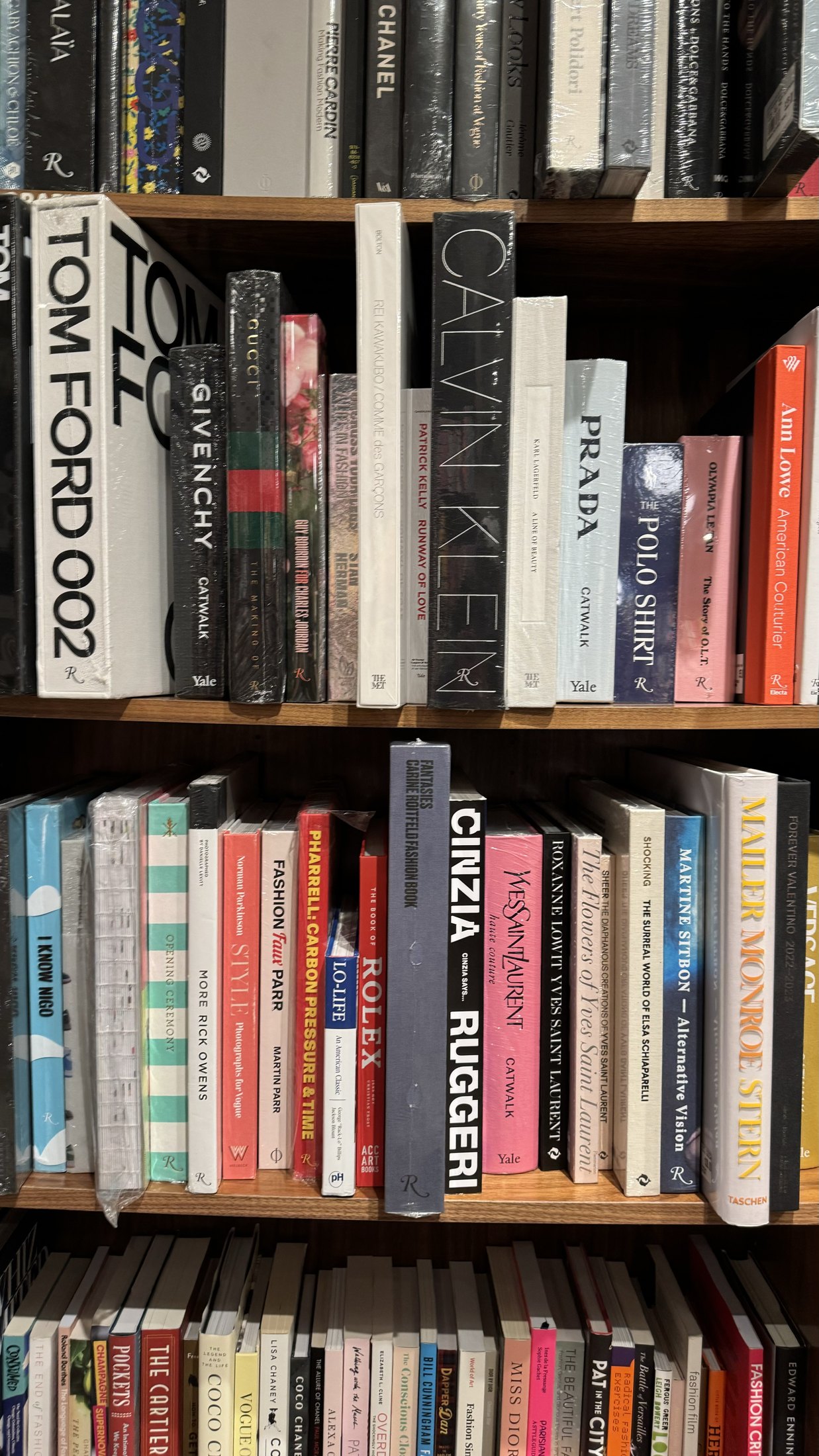 A bookshelf filled with fashion, photography and design books