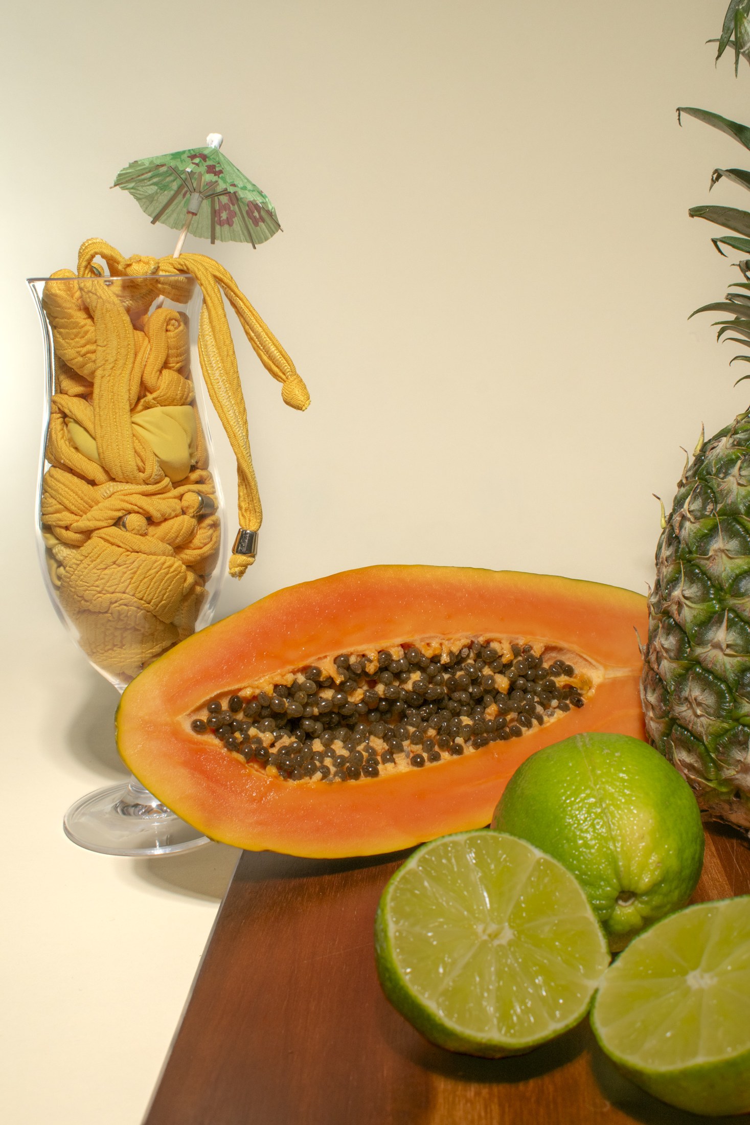 Yellow swimwear styled with tropical fruit