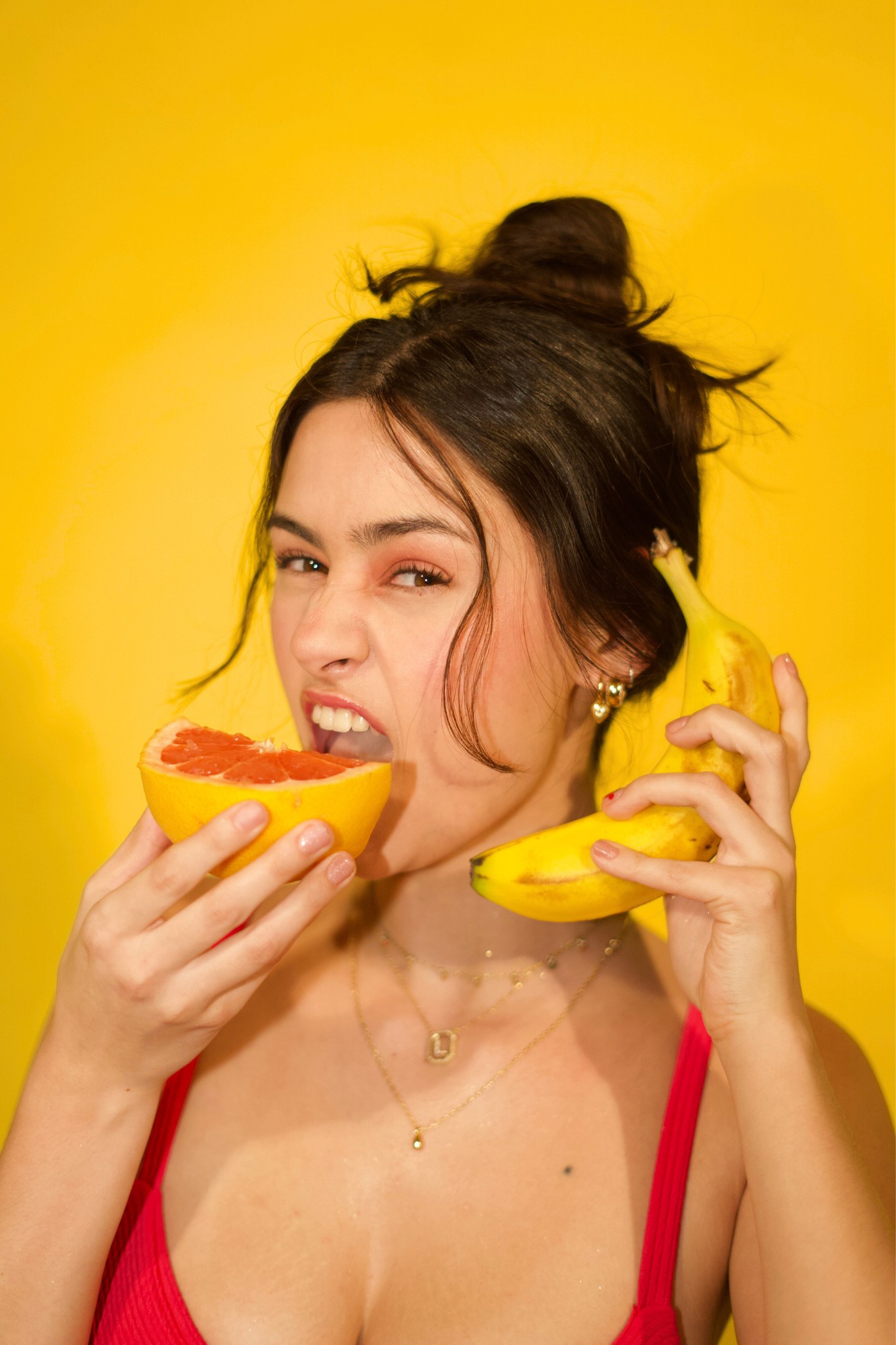 Citrus props and yellow color frame a playful portrait
